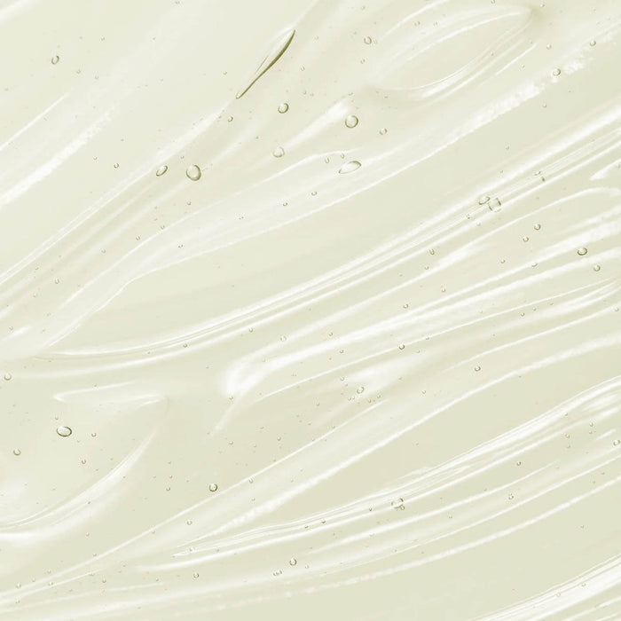 Swatch of shampoo - clear liquid texture. All natural ingredients including rosemary, lavender, pineapple enzymes, olive oil.