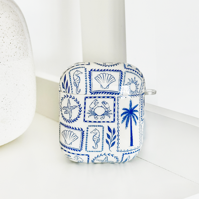 Blue AirPods case with tropical shell, palm, and sea creature pattern; made from durable TPU.