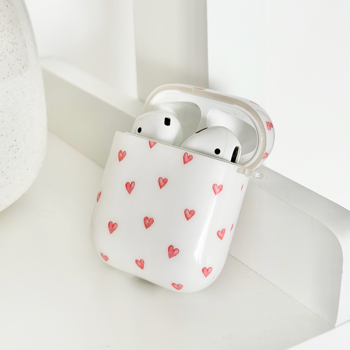 Coconut Lane AirPods case with a mini hearts pattern, white background, and smooth shockproof finish.