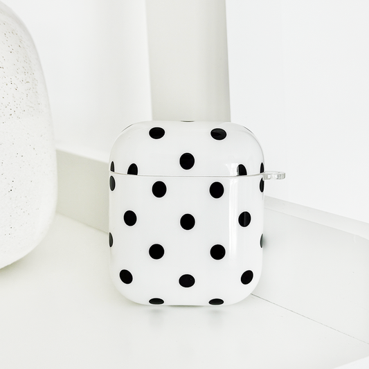 White Airpods case with black polka dots from Coconut Lane.