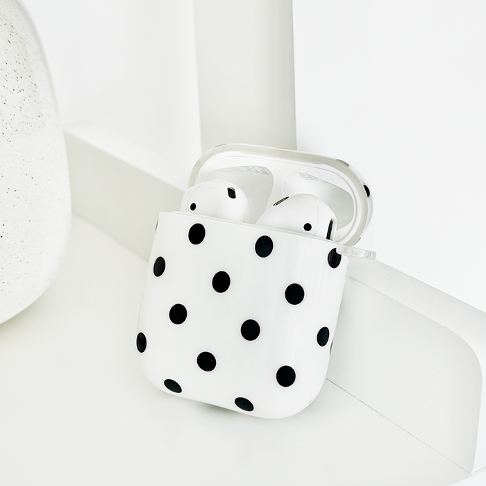 White AirPods case with black polka dots and a smooth finish from Coconut Lane.