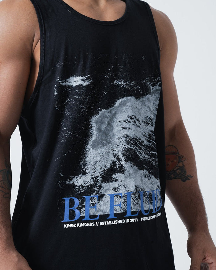 Kingz Be Fluid Tank Black - Upper Body Front View Male Athlete Ocean Wave Graphic Large BE FLUID Text Blue Kingz Kimonos Established 2011 Premium Craftsmanship Streetwear [color:Black]