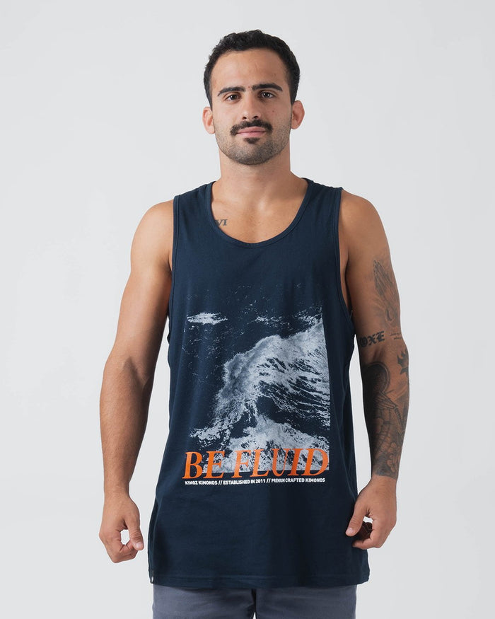Kingz Be Fluid Tank Navy - Front View Male Athlete Ocean Wave Graphic Large BE FLUID Text Orange Kingz Kimonos Established 2011 Text Sleeveless Casual Fit Streetwear [color:Navy]