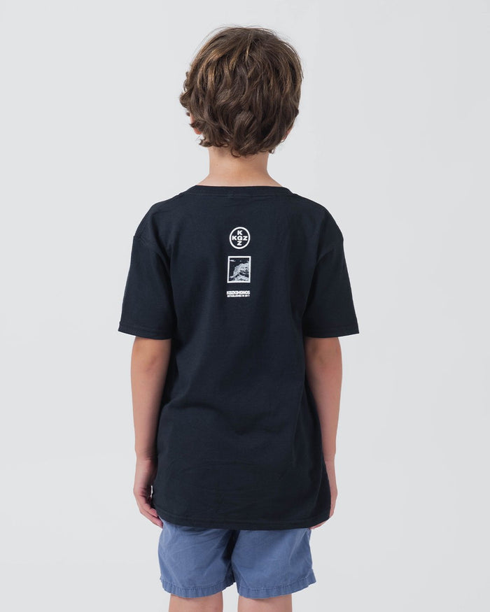 Kingz Be Fluid Youth Tee Black - Back View Young Male Black Tee KGZ Circle Logo Upper Back Graphic Design Streetwear Casual [color:Black]