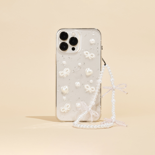 Beaded phone strap with small pearl bows attached to a smartphone in a pearl case, decorated with cute charms.