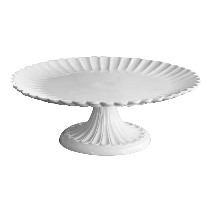 White ceramic cake stand on a white background