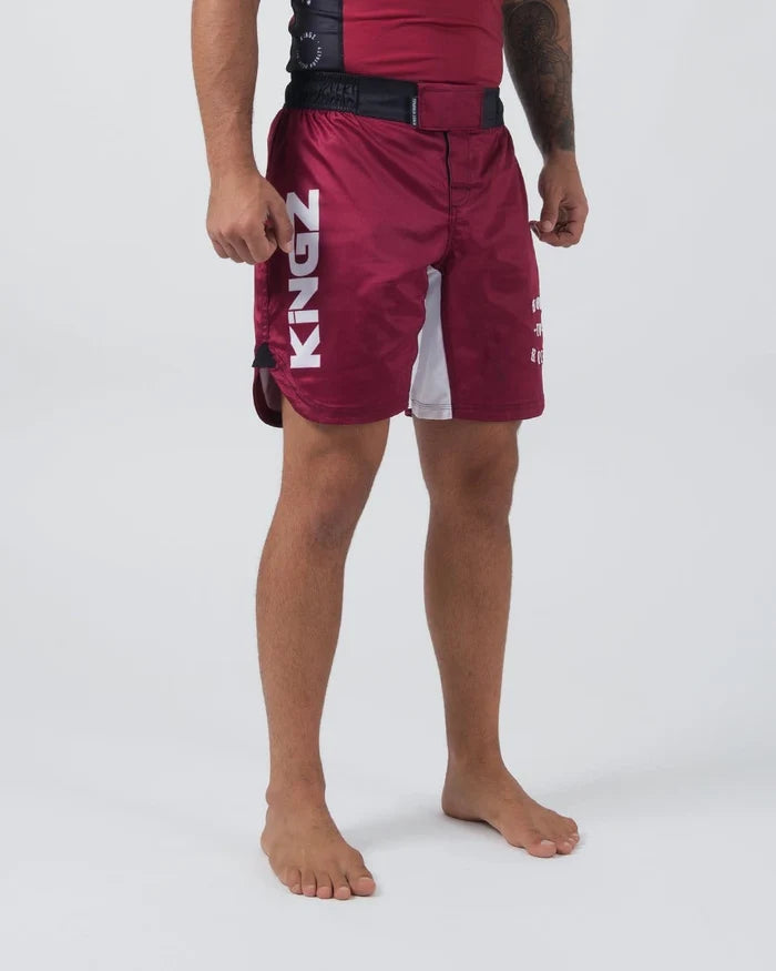 Kingz Born To Rule Shorts Maroon - Full Body Front View Male Athlete Bold White KINGZ Vertical Text Black Waistband Side Split Design Grappling Shorts BJJ No-Gi Training [color:Black]