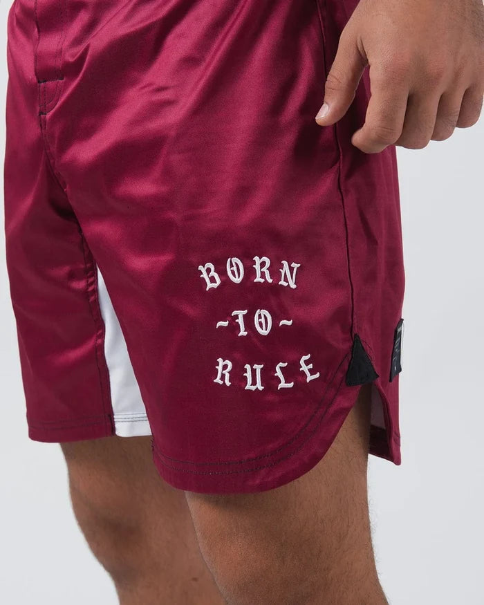 Kingz Born To Rule Shorts Maroon - Close-Up Side View Male Athlete Maroon White Side Panel Bold "BORN TO RULE" Text Black Label Grappling Shorts BJJ No-Gi Training [color:Black]