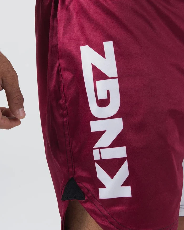 Kingz Born To Rule Shorts Maroon - Close-Up Side View Bold White KINGZ Text Black Triangle Detail Maroon Fabric Grappling Shorts BJJ Training [color:Black]