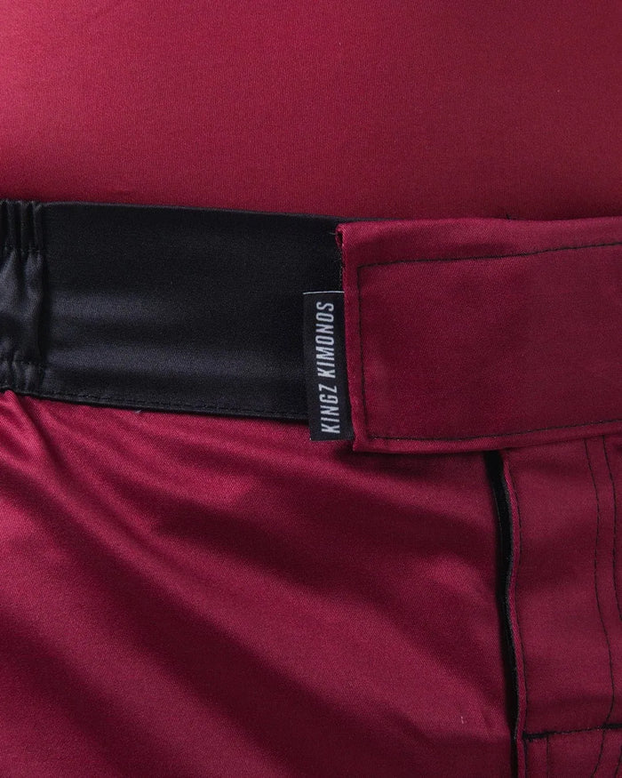 Kingz Born To Rule Shorts Maroon - Close-Up Detail View Black Waistband Kingz Kimonos Tag Maroon Fabric Stitching Grappling Shorts BJJ No-Gi Training [color:Black]