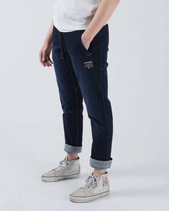 Kingz Casual Gi Pant - Denim - Midsection Front View Male Model Rolled Cuffs Drawstring Waist White Label Patch Dark Blue Denim Relaxed Fit BJJ Gi Training Apparel [color:Denim]
