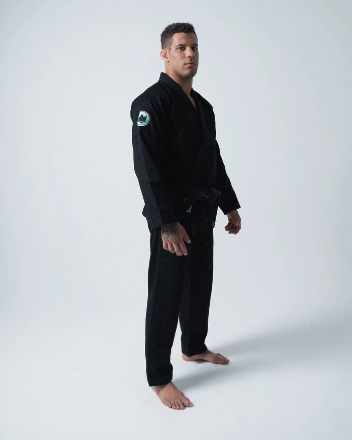 Kingz Classic 3.0 Jiu Jitsu Gi - Black - Full Body Front View Male Athlete Black Gi Green Shoulder Patch Logo Traditional Fit BJJ Gi Training Grappling [color:Black]