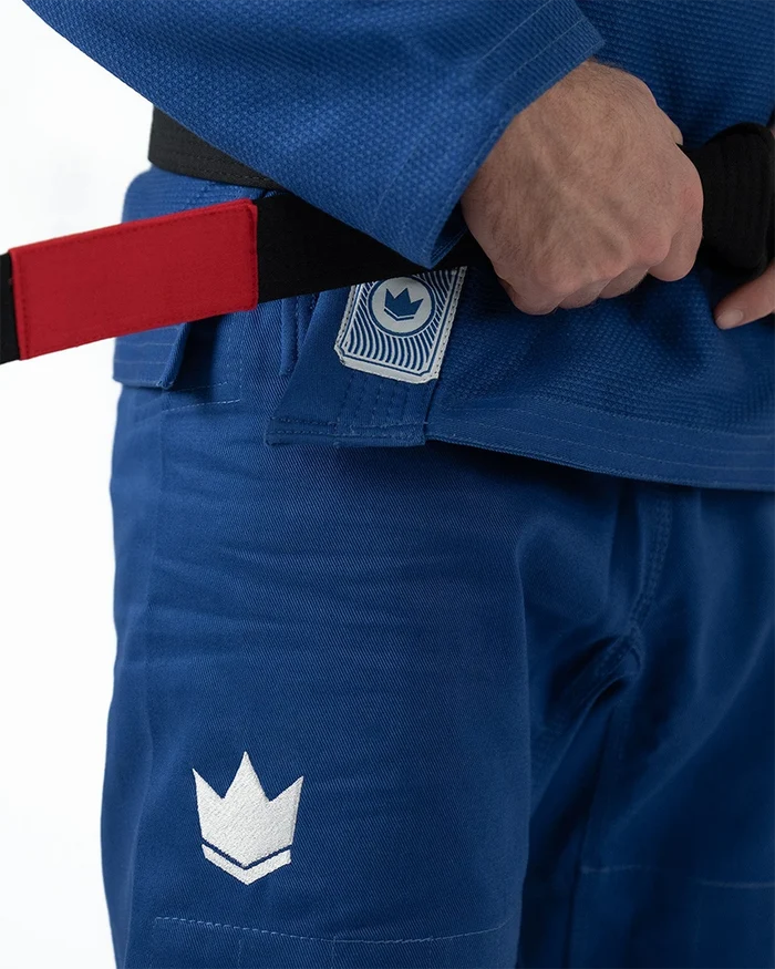 Kingz Classic 3.0 Jiu Jitsu Gi Blue - Close-Up Detail View Hand Tying Belt Blue Fabric Crown Badge Logo White Stitching Durable Design BJJ Gi [color:Blue]