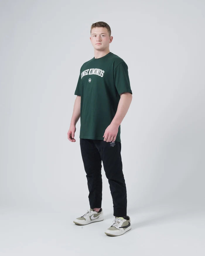Kingz Collegiate Tee Dark Forest Green - Full Body Front View Male Athlete KINGZ Kimonos Text Chest Classic Fit Casual T-Shirt BJJ Training Apparel [color:Dark Forest Green]