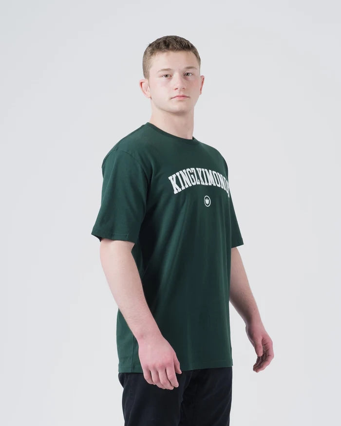 Kingz Collegiate Tee Dark Forest Green - Front View Male Athlete KINGZKIMONOS Arched White Text Center Chest Short Sleeve Classic Fit Casual BJJ Training Apparel [color:Dark Forest Green]