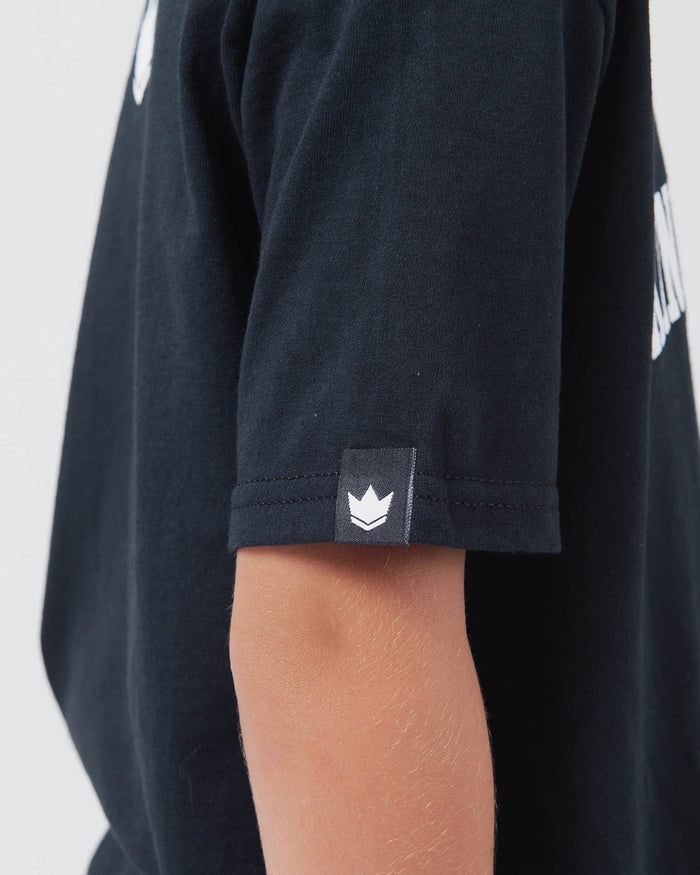 Kingz Collegiate Youth Tee Black - Close-Up Side View Youth Sleeve Crown Badge Black Cotton Soft Fabric Streetwear [color:Black]