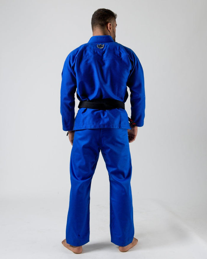 Kingz Comp 450 V6 Gi - Blue - Back View Male Athlete Blue Gi Black Belt Crown Badge Upper Back Durable Fabric Jiu Jitsu Gear Training BJJ [color:Blue]