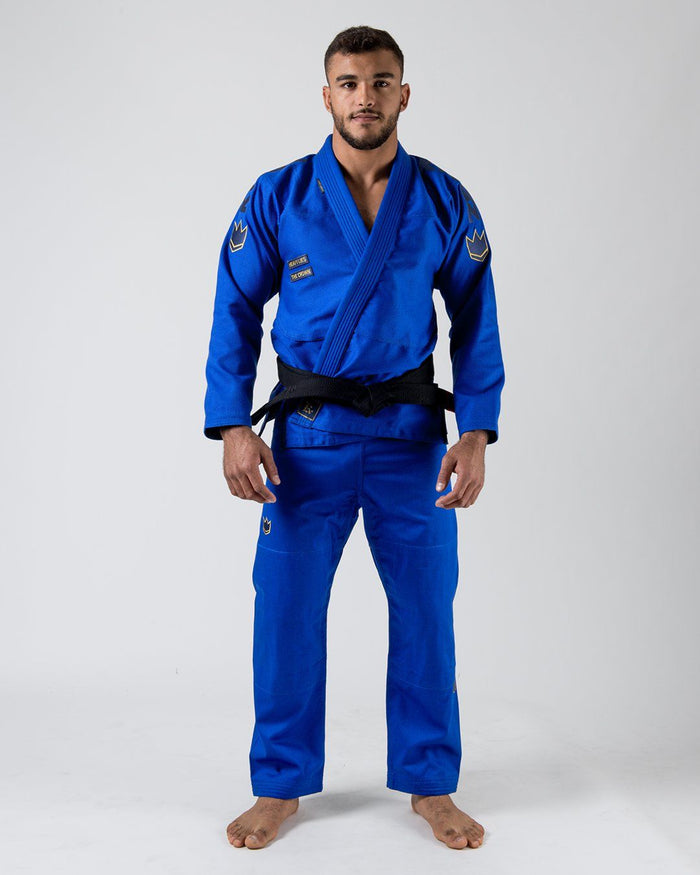 Kingz Comp 450 V6 Gi - Blue - Full Body Front View Male Athlete Blue Gi Gold Crown Shoulder Patches Black Belt Contrast Stitching Durable Fabric Jiu Jitsu Gear Training [color:Blue]
