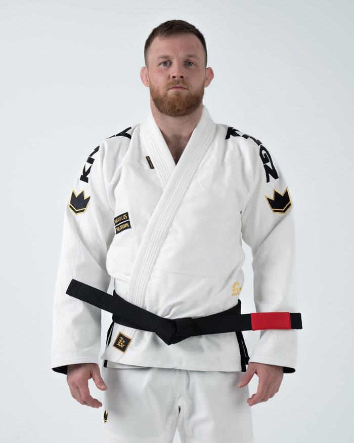 Kingz Comp 450 V6 Gi - White - Front View Male Athlete Black Belt Gold Crown Shoulder Patches Black KINGZ Text Sleeves Embroidered Logo Chest Durable Weave Jiu Jitsu Gear [color:White]