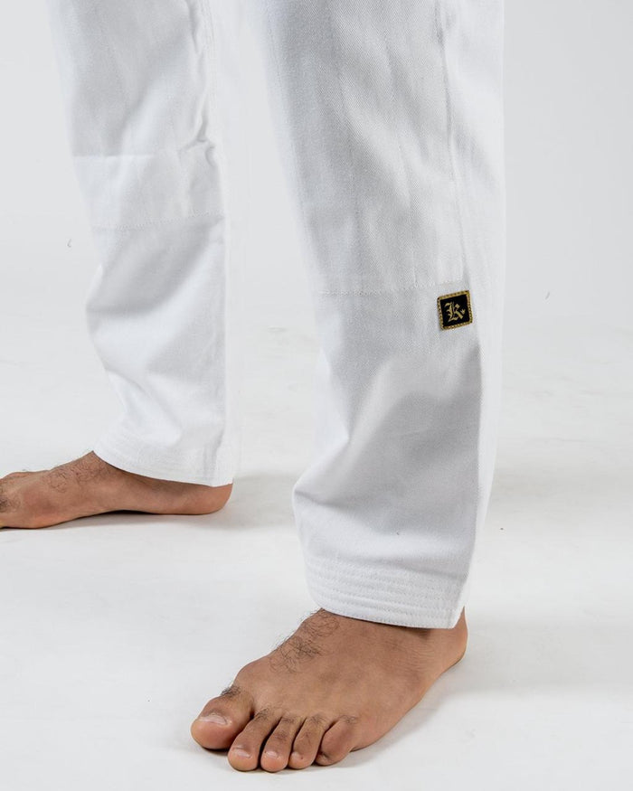 Kingz Comp 450 V6 Gi - White - Lower Body Close-Up View White Pants Black Gold Crown Badge Left Leg Durable Stitching Jiu Jitsu Gear Training Gi [color:White]