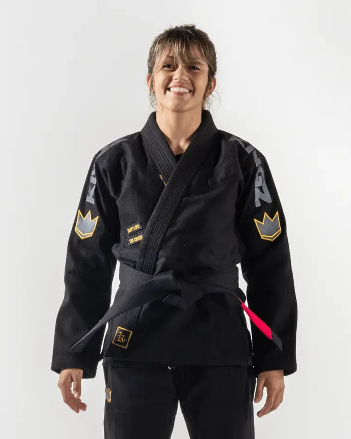 Kingz Comp 450 V6 Women's Gi Black - Front View Female Athlete Black Gi Yellow Crown Patches Embroidered Logos Contrast Stitching Durable Weave BJJ Gi Training Competition [color:Black]