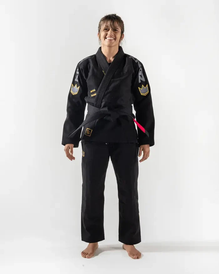 Kingz Comp 450 V6 Women's Gi - Black - Full Body Front View Female Athlete Black Gi Yellow Crown Sleeve Patches KINGZ Shoulder Text Pink Belt Loop Durable Weave BJJ Training Gi [color:Black]