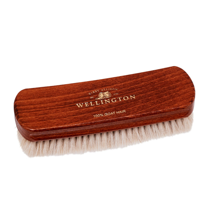 A Deluxe Wellington Goat Hair Finishing Brush designed for dusting shoes on a white background by KirbyAllison.com.