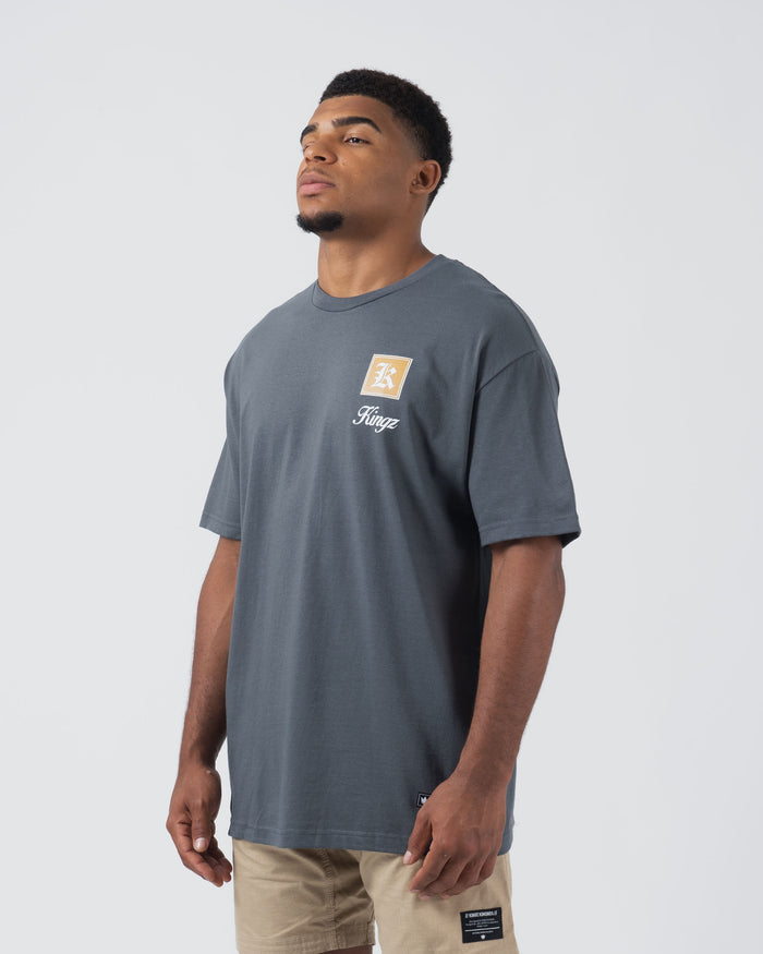 Kingz Dreamer Tee Grey - Front View Male Model Short Sleeve Grey Tee Gold K Logo Left Chest White Kingz Text Casual Streetwear [color:Grey]