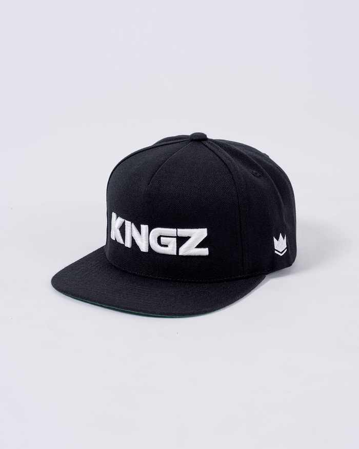 Kingz Emblem Snapback Black - Angled Front View Black Hat White KINGZ Text Front White Crown Badge Side Classic Flat Brim Design BJJ Training Apparel [color:Black]