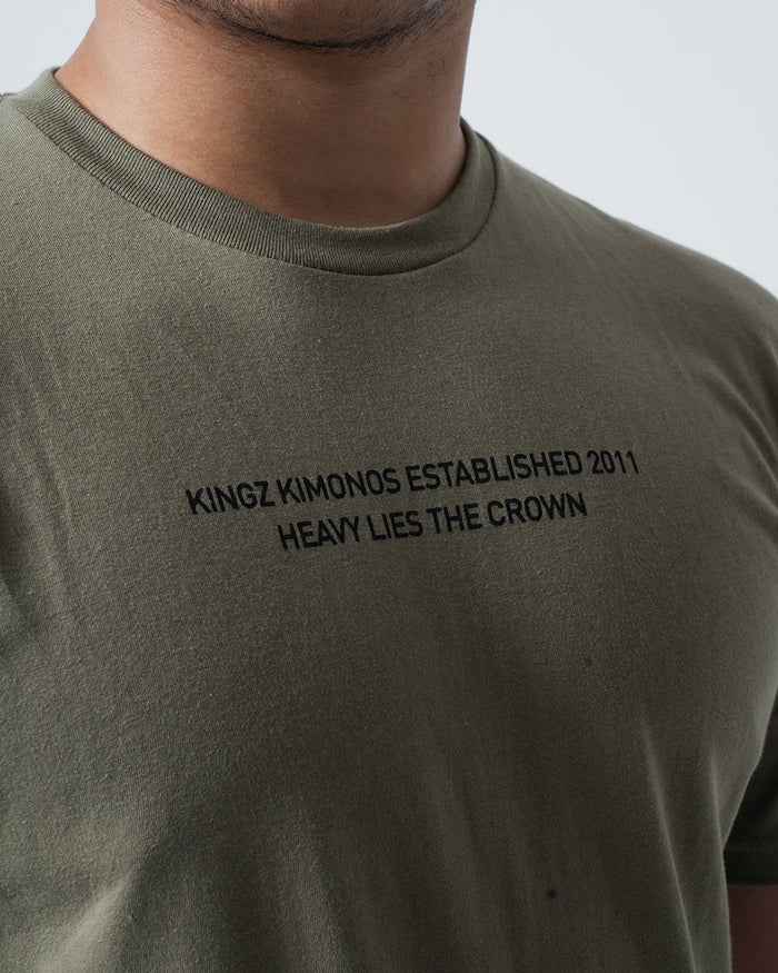 Kingz Est. 2011 Tee Military Green - Close-Up Front View Male Athlete Black Text "KINGZ KIMONOS ESTABLISHED 2011 HEAVY LIES THE CROWN" Center Chest Soft Cotton Streetwear [color:Military Green]