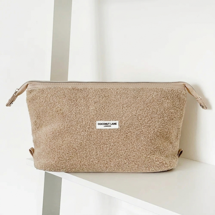 Teddy nude coloured boucle textured Makeup Bag with zip closure and Cocopup logo.