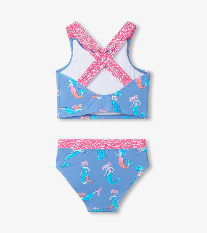 Back view of girls mermaid tankini swimsuit showing triple crisscross straps and coordinated patterned trim.