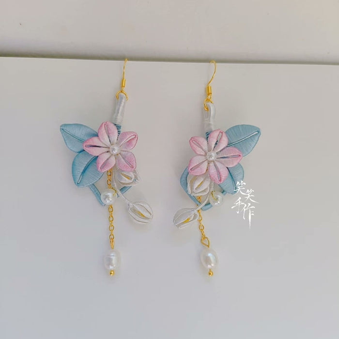 Elegant pink Chanhua flower and blue leaf earrings with dangling pearls, showcasing artisan craftsmanship.