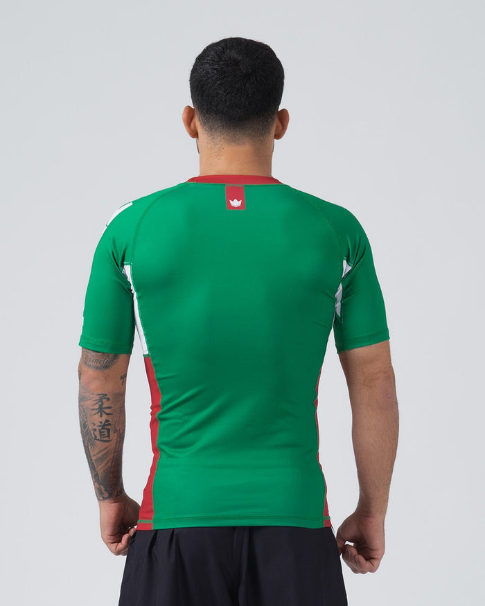 Kingz Jersey Rashguard Mexico Edition - Full Body Back View Male Athlete Short Sleeve Green Body Red Crown Logo Upper Back Center Red Collar White Red Side Panel Stripes Mexico Colors BJJ National Pride MMA Training [color:Green/Mexico]