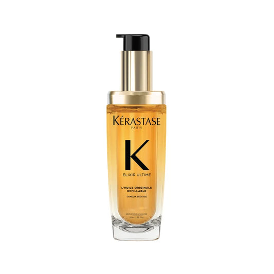 A clear glass bottle with a pump dispenser, containing yellow-hued hair oil, labeled Kérastase Elixir Ultime L'Huile Originale.