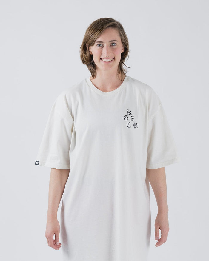 Kingz KGZ OE Tee Natural - Front View Female Model Short Sleeve Off-White Tee Black KGZ CO. Text Left Chest Small Crown Badge Sleeve Casual Streetwear Apparel [color:Natural]