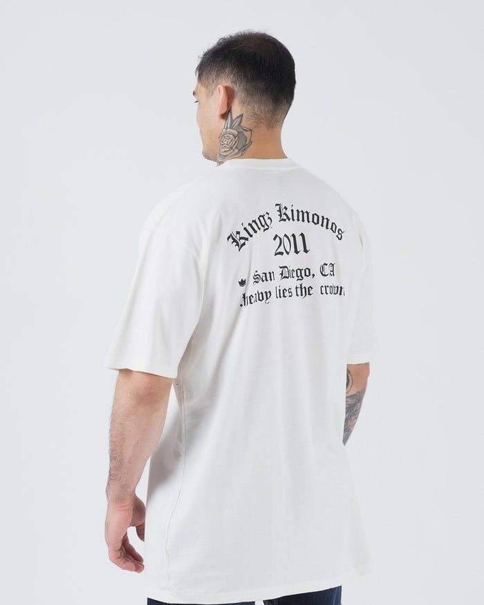Kingz KGZ OE Tee Natural - Back View Male Model Black Gothic Text "Kingz Kimonos 2011 San Diego, CA Heavy Lies the Crown" Short Sleeve Relaxed Fit Streetwear [color:Natural]