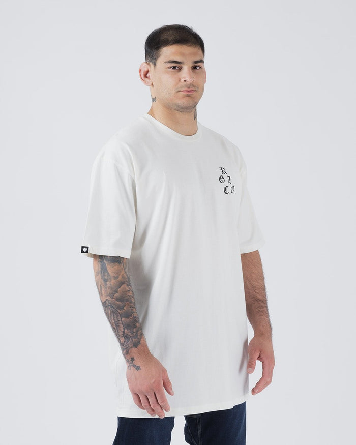 Kingz KGZ OE Tee Natural - Front View Male Athlete Short Sleeve Off-White Tee Black KGZ Text Chest Crown Logo Sleeve Casual Fit Streetwear [color:Natural]