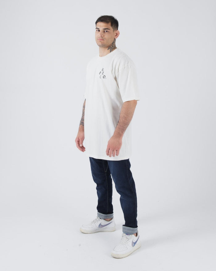 Kingz KGZ OE Tee Natural - Three-Quarter View Male Model Minimalist Design Short Sleeve Natural Color Black Text Chest Casual Streetwear [color:Natural]