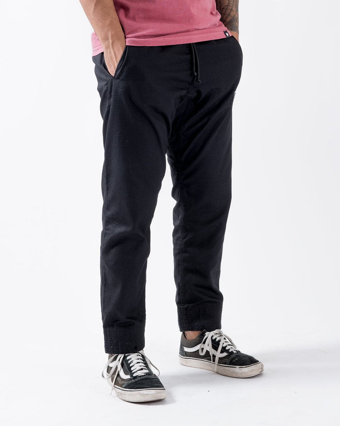 Kingz Casual Rip Stop Gi Pant Black - Full Body Front View Male Athlete Black Drawstring Waist Ribbed Cuffs Relaxed Fit Durable Fabric BJJ Gi Training Apparel [color:Black]