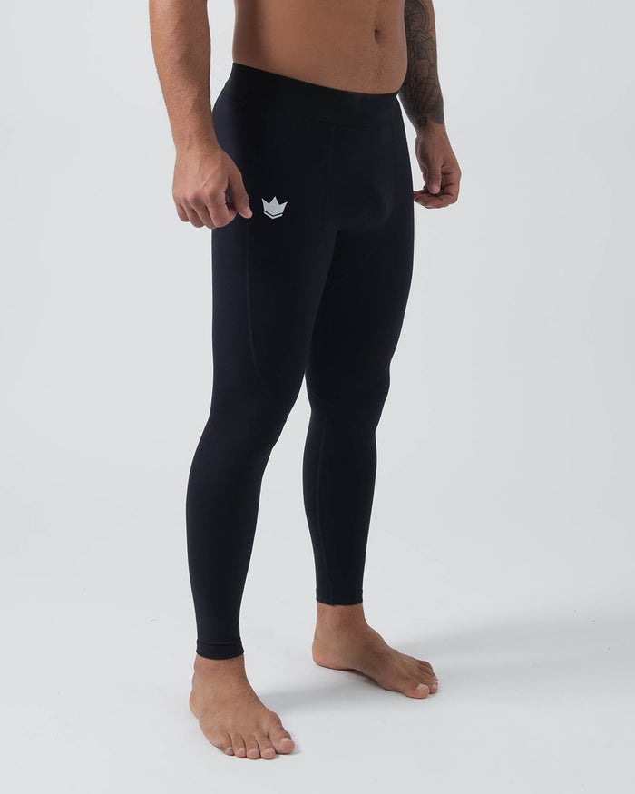 Kingz Kore Grappling Spats Black - Full Body Right Side Profile Shirtless Tattooed Male Athlete All-Black Small White Crown Logo Left Thigh High-Waist Full-Length Compression Fit Men's No-Gi BJJ Spats Kore Collection [color:Black]
