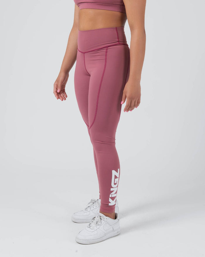 Kingz Kore Women's Grappling Spats Red - Full Body Right Side Profile Female Athlete Dusty Rose Mauve KINGZ Large White Vertical Text Right Calf High-Waist Side Pocket Seam Full-Length Compression Fit Women's No-Gi BJJ Spats Kore Collection [color:Dusty Rose]