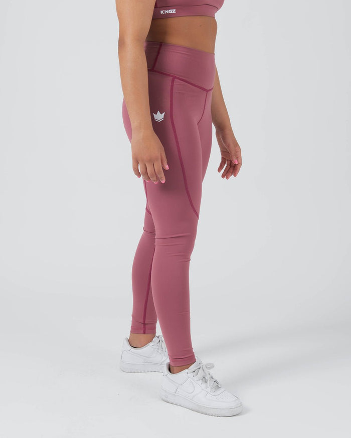 Kingz Kore Women's Grappling Spats Red - Full Body Left Side Profile Female Athlete Dusty Rose Mauve Small White Crown Logo Left Thigh High-Waist Band Full-Length Compression Fit White Sneakers Women's No-Gi BJJ Spats Kore Collection [color:Dusty Rose]