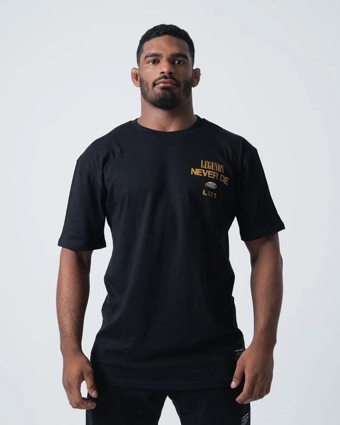 Kingz Legends Never Die Tee Black - Full Body Front View Male Athlete Black T-Shirt Gold "Legends Never Die" Text Left Chest Classic Fit Crew Neck BJJ Training Apparel [color:Black]