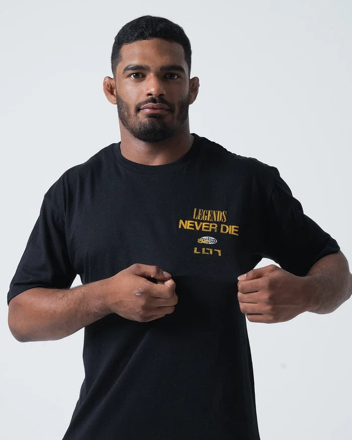 Kingz Legends Never Die Tee Black - Front View Male Athlete Black T-Shirt Gold "Legends Never Die" Text Left Chest Bold Graphic Design Casual Fit BJJ Training Apparel [color:Black]