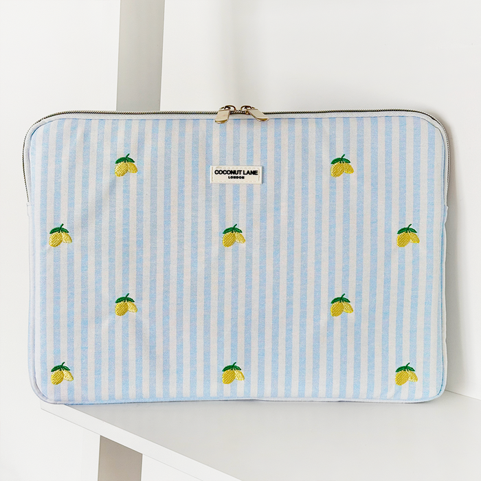 Laptop sleeve with bright yellow lemon print on a white background by Coconut Lane.
