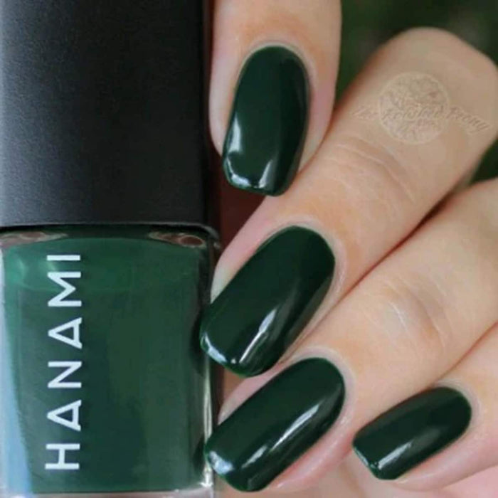 Green nail polish with 'HANAMI' branding on a close-up of nails and bottle.