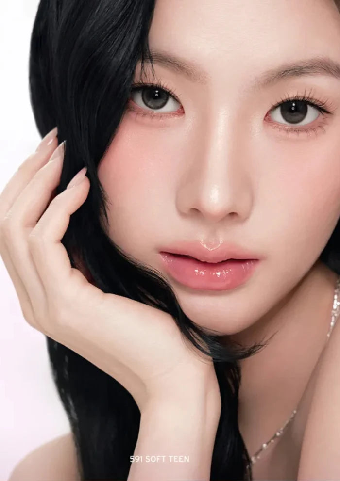 Close-up of a person with black hair and pink lipstick on a white background