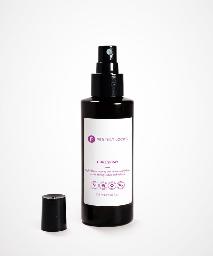 A black spray bottle of Perfect Locks Perfect Curl Defining Spray stands upright with its cap to the side on a white background.