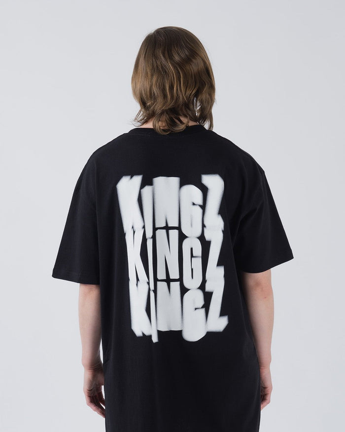 Kingz Quake Tee Black - Back View Male Model Oversized Fit White KINGZ Text Stacked Vertically Center Back Short Sleeve Casual Streetwear [color:Black]